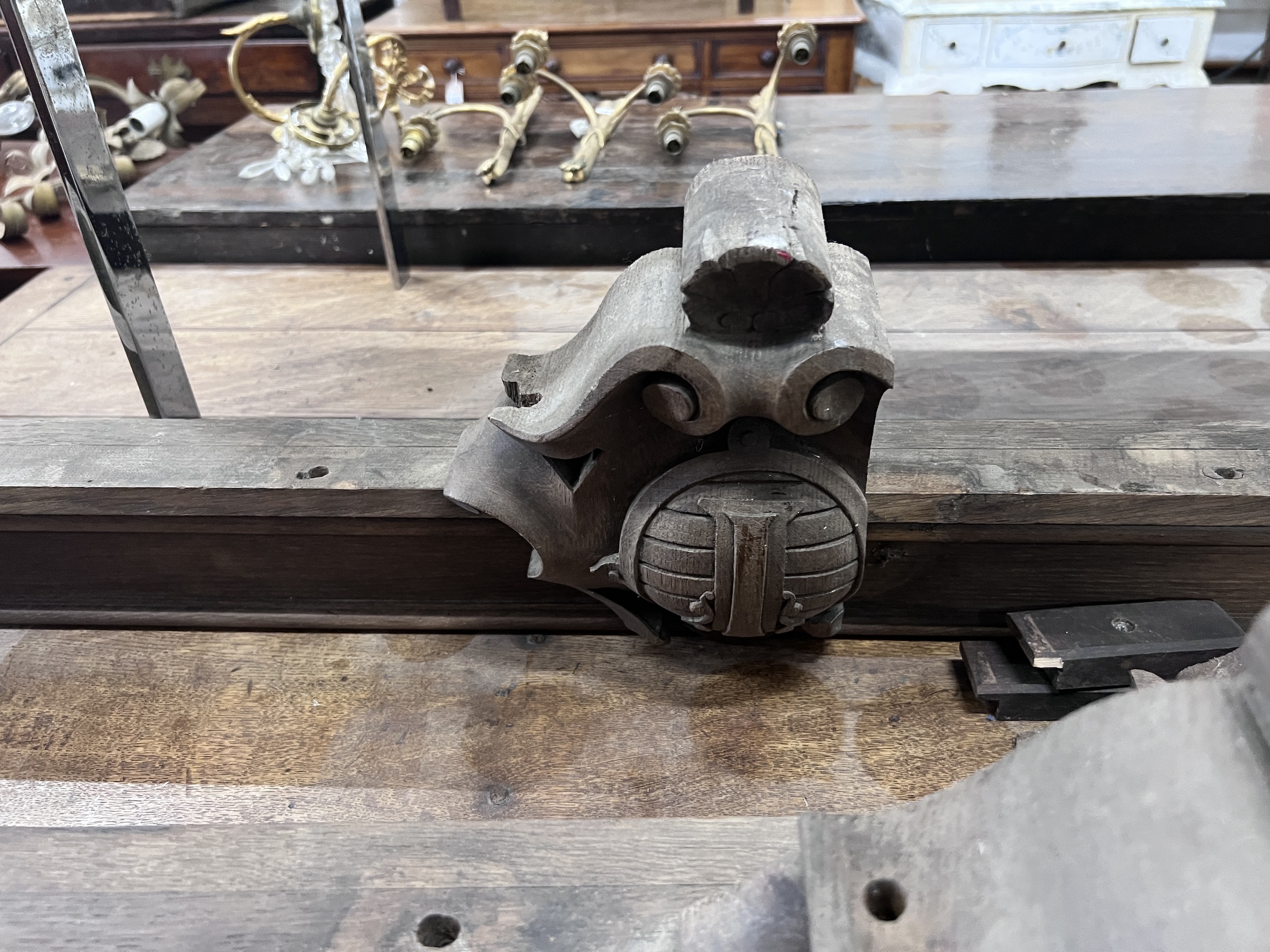 A pair of shield carved oak pediments, width 149cm, height 27cm